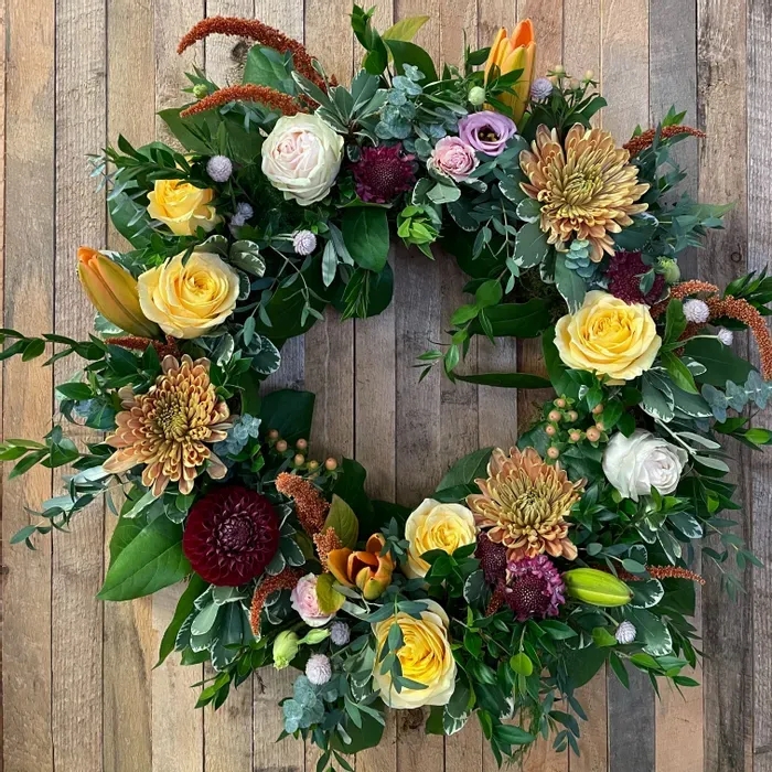 Floral Wreath with Elegant All-White Blooms and Lush Foliage Base