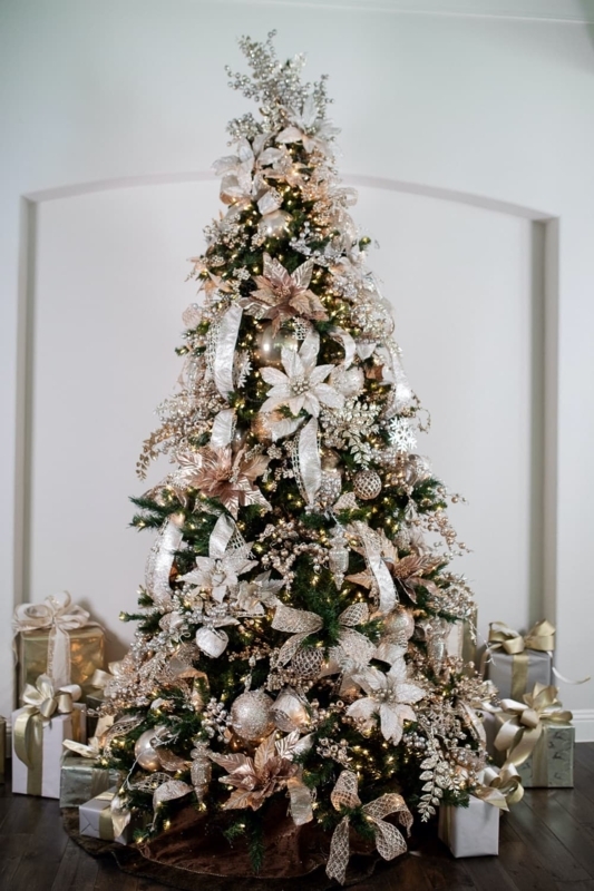 Glamorous Gold Christmas Tree Styling with Oversized Floral Accents and Flocked Needles