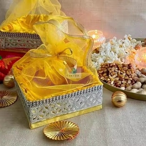 Gold Decorative Tray Set with Floral Cutouts and Beaded Rim Detail.