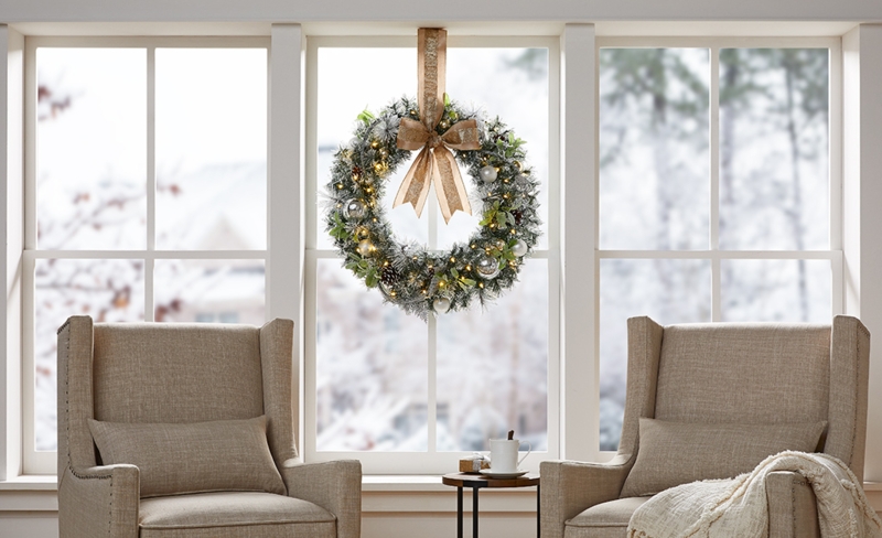 Holiday Wreath on Dark Slatted Wall for Modern Fireplace Decor