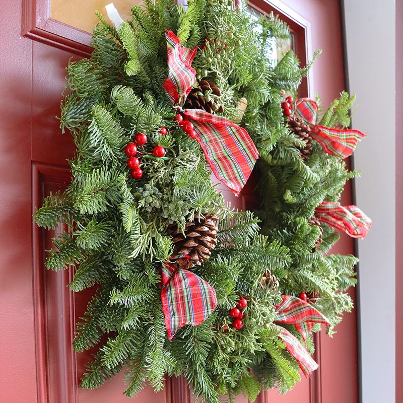 Lush Evergreen Wreath with Dense Berry Clusters and Plaid Bows
