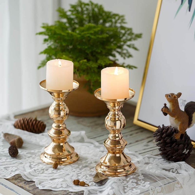 Pillar Candle Holder Set of Five with Slender Stems in Polished Metallic.
