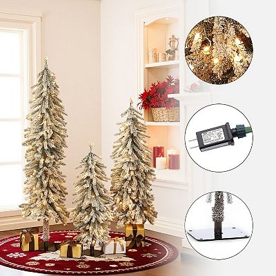 Pre-Lit Flocked Slim Tree Set: Slim Trio on Natural Wood Bases.