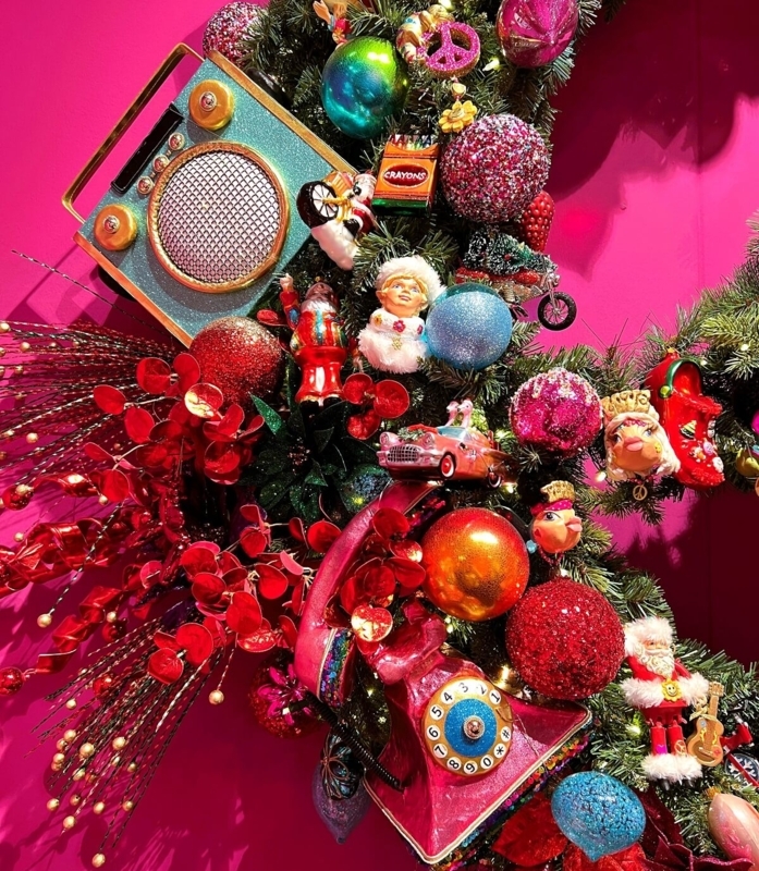 Retro Christmas Living Room with Jewel Toned Baubles and Green Velvet Chair