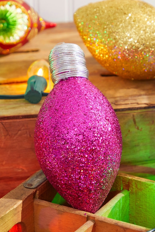 Retro Christmas Ornament: Hot Pink Glittered Oversized Bulb Silhouette.