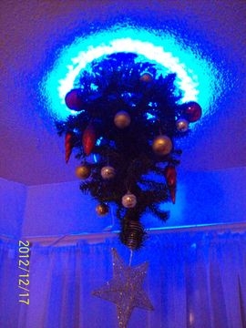 Split Design Christmas Tree with Glowing Neon Portal Rings (70 chars)