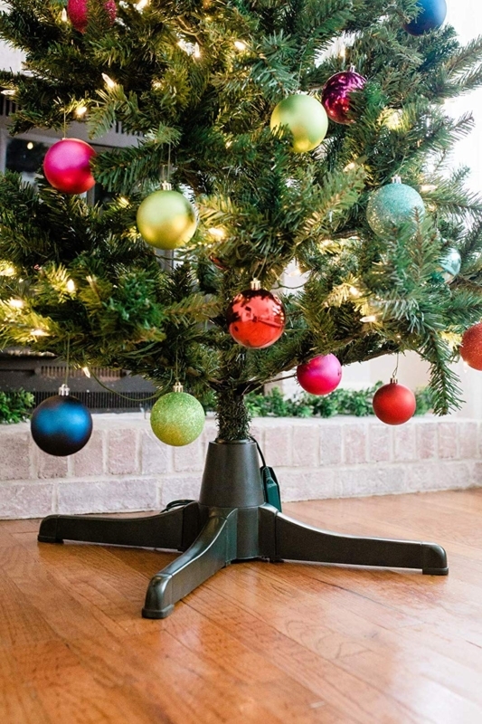 Traditional Forest Green Christmas Tree Stand on Patterned Rug