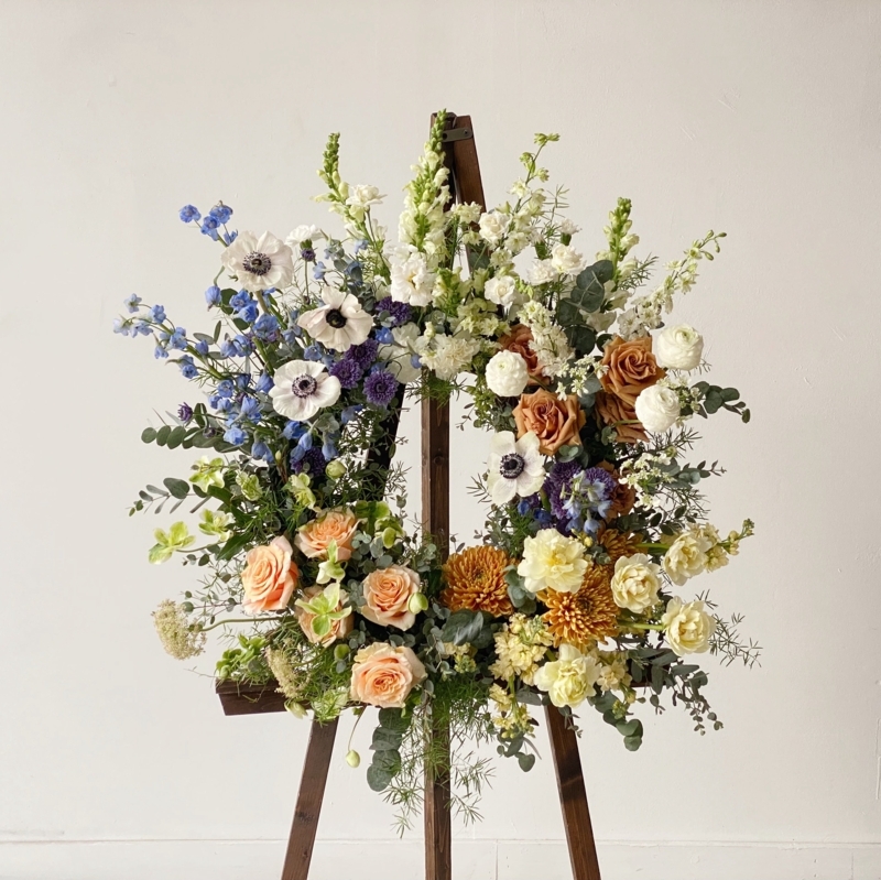 Upright Floral Wreath on Minimalist Wood Tripod Easel Display