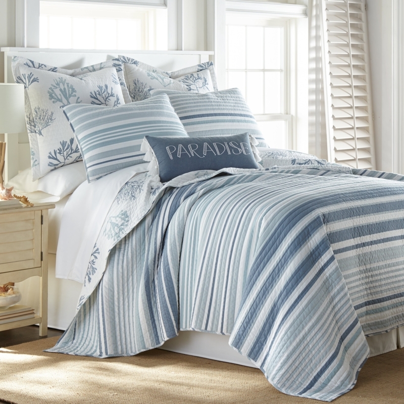 Bedding Set featuring Teal Coral Print & Layered Pillow Styling.