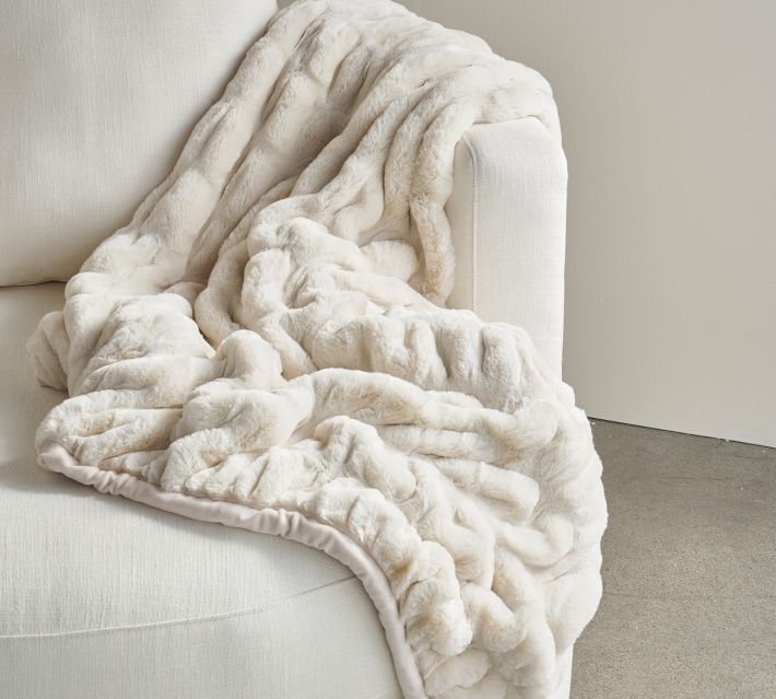 Ivory Faux Fur Throw Blanket with Ruched Texture and Draped Silhouette