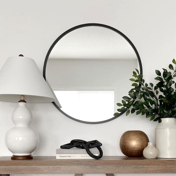Round Wall Mirror with Thin Black Frame over Vertical Stack Tile
