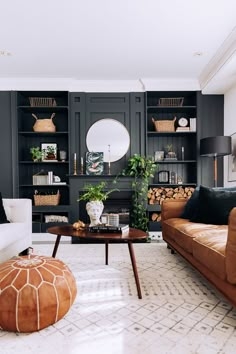 Sectional Sofa: Curved Cream Seating against Dark Wall with Niches