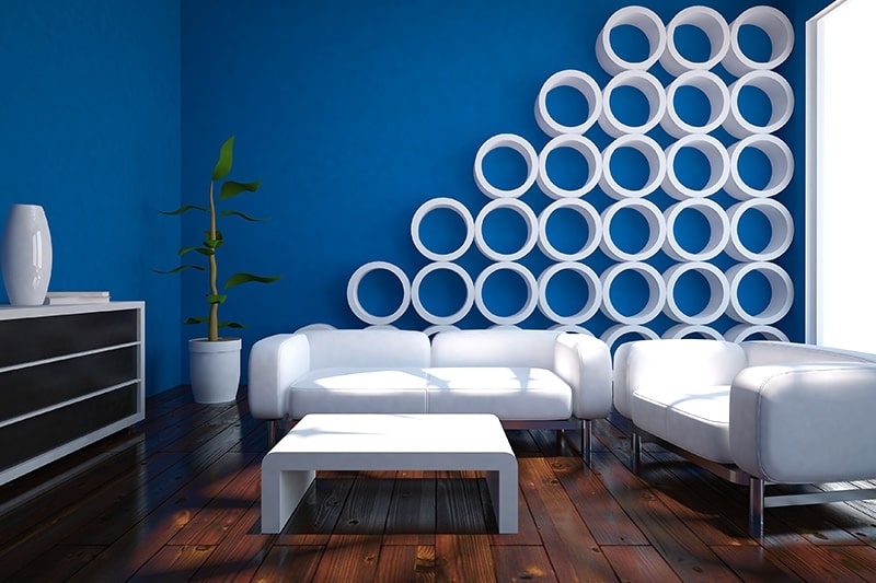 Sofa Scene: Cobalt Walls, White Wall Molding, Tripod Floor Lamp.