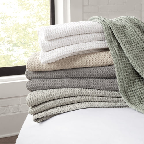 Stacked Waffle Weave Throw Blankets in Neutral Earth Tones