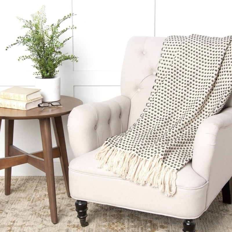 Throw Blanket: Gray Woven Geometric Pattern with Knotted Fringe Detail.