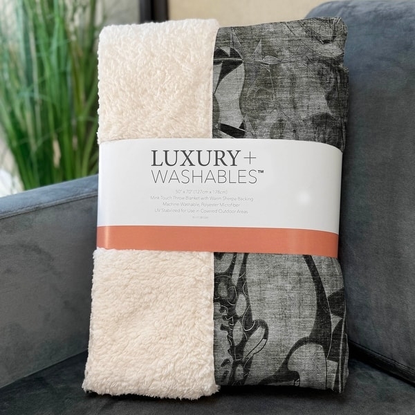 Throw Blanket: Modern Navy Floral Print Reversing to Plush Sherpa.