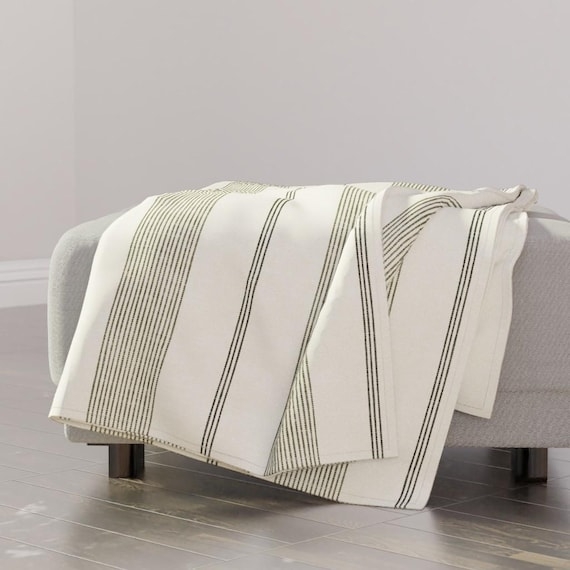 Throw Blanket: Sage Green Striped Woven Fabric with Fringed Edges.