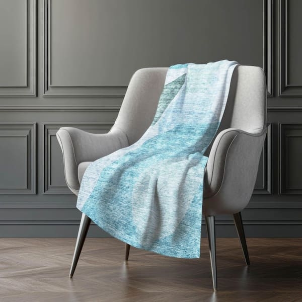 Throw Blanket: Teal Geometric Woven Pattern with White Sherpa Lining.
