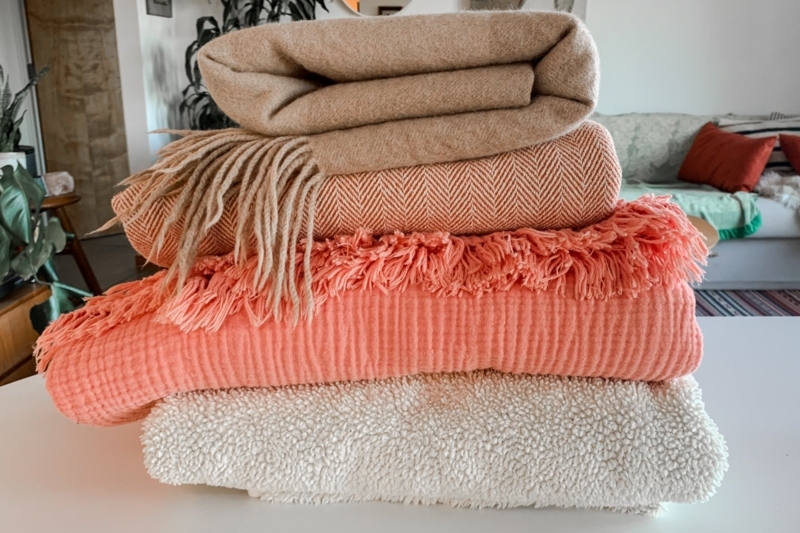 Throw Blankets Folded in Wire Basket, Textured Waffle Weave Storage