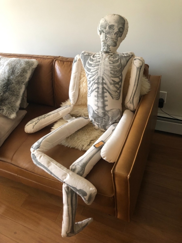 Throw Pillow with Articulated Limbs and Vintage Gothic Skeleton Graphic