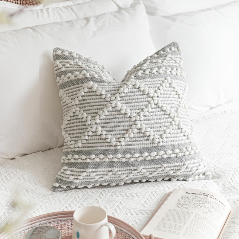 Throw Pillow with Corner Tassels & Tufted Accents