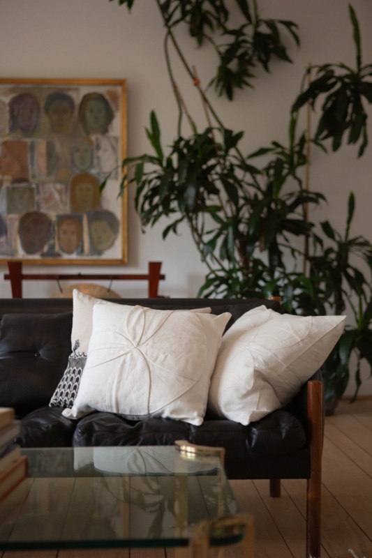 Throw Pillow with Exposed Stitching and Artisan Hand Appliqued Motifs