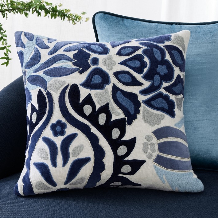 Throw Pillow with Navy Base and Raised Floral Applique Details