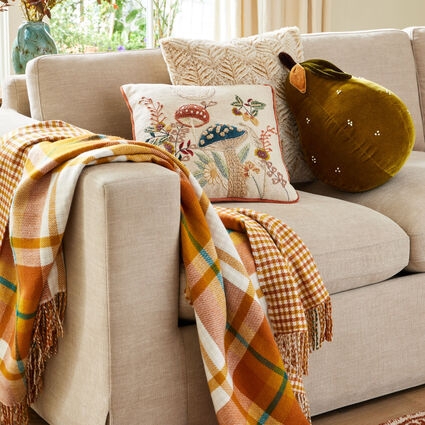 Throw Pillows: Layered Arrangement, Autumnal Floral Pattern, Cozy Style.
