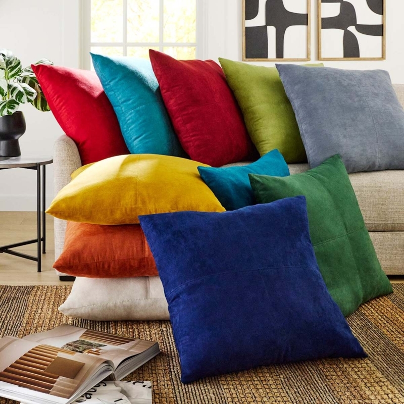 Turquoise Throw Pillow with Suede Texture and Piped Edges.