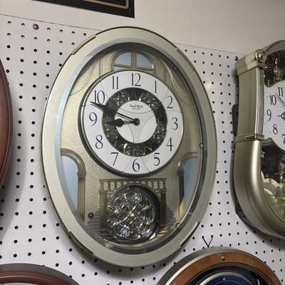 Wall Clock Ornate Wood Toned Musical Figurines Rotating Pendulum