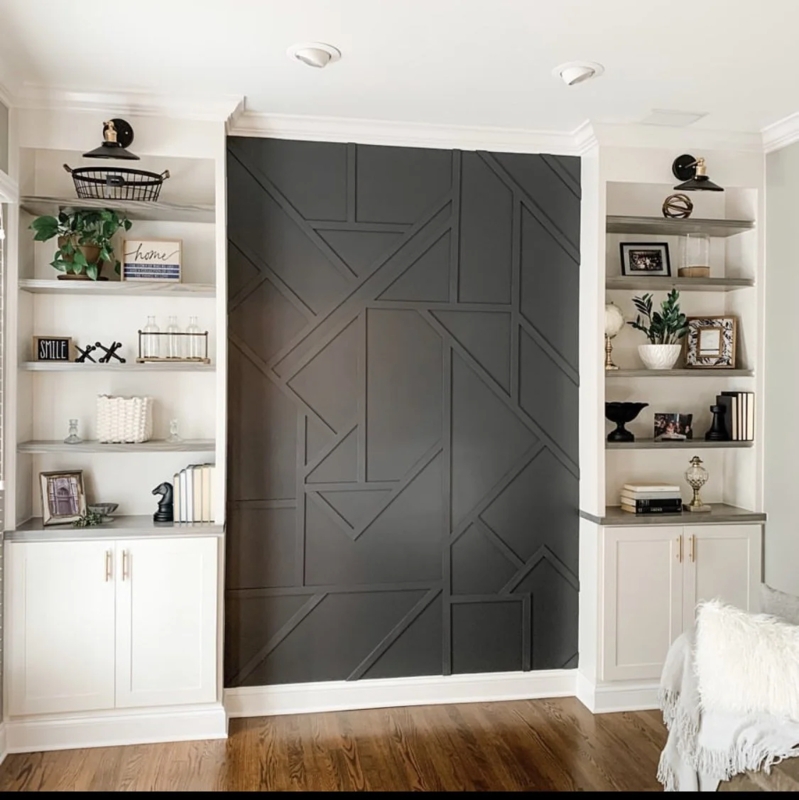 Wood Dresser with Tapered Legs against Black Geometric Molding Wall