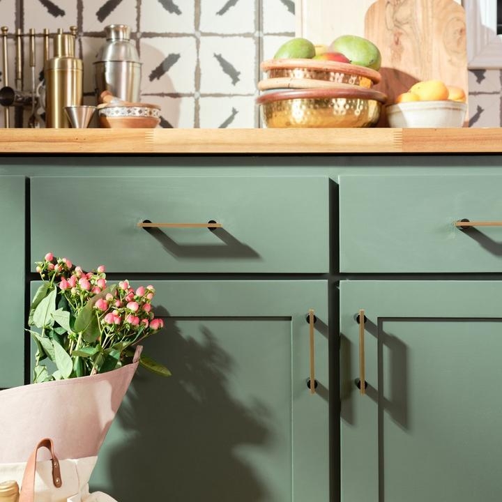 Bohemian Kitchen: Rattan Pendants, Exposed Beams, White Farmhouse Sink