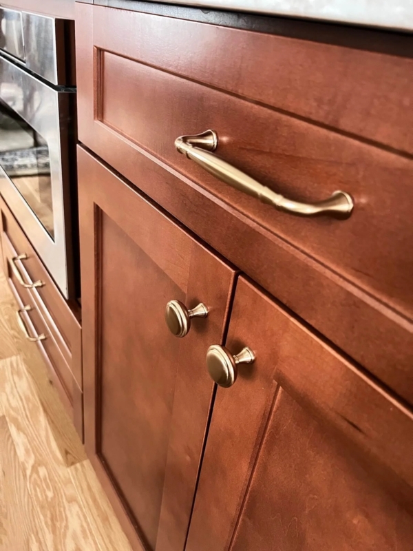 Cabinet Hardware: Honey Bronze Hardware on Blue Cabinets, Mixed Styles.