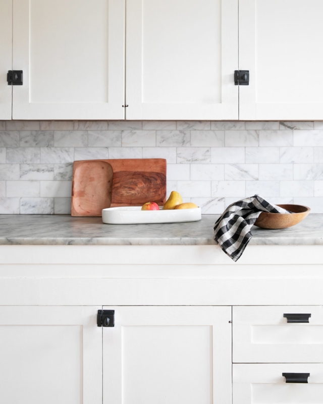 Cabinet Pull: Brushed Brass Vertical Pull on Navy Blue Cabinetry