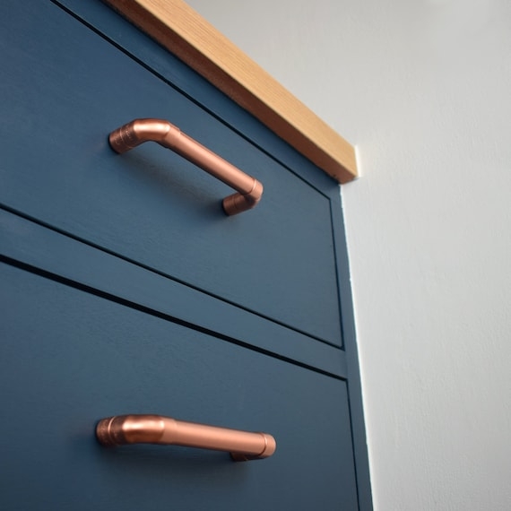 Cabinet Pull Brushed Copper Cylindrical Bar on Dark Cabinet Contrast