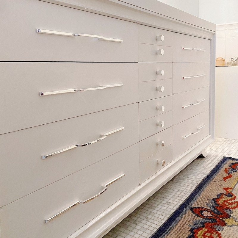Cabinet Pull Fluted Grip Brushed Gold Vertical Mount on Wood Panel
