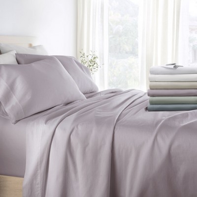 Classic Blue Sateen Sheet Set with Smooth Finish and Wood Headboard