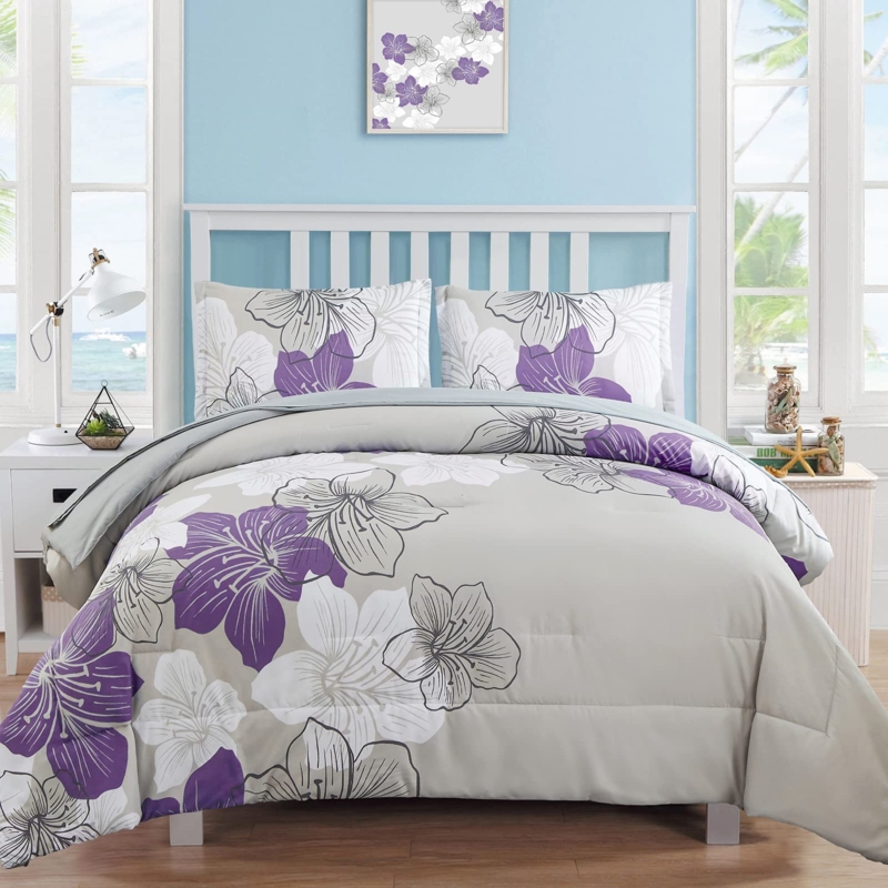 Comforter with Vibrant Purple Floral Print. Botanical Bedding styling.