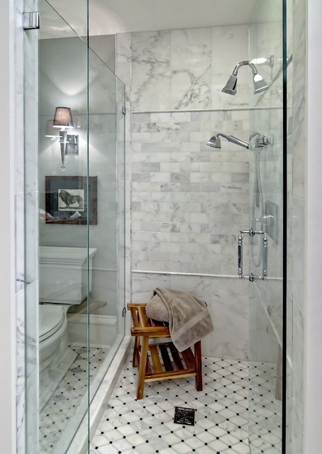Dark Stone Topped Built-In Shower Bench amidst White Subway Tile