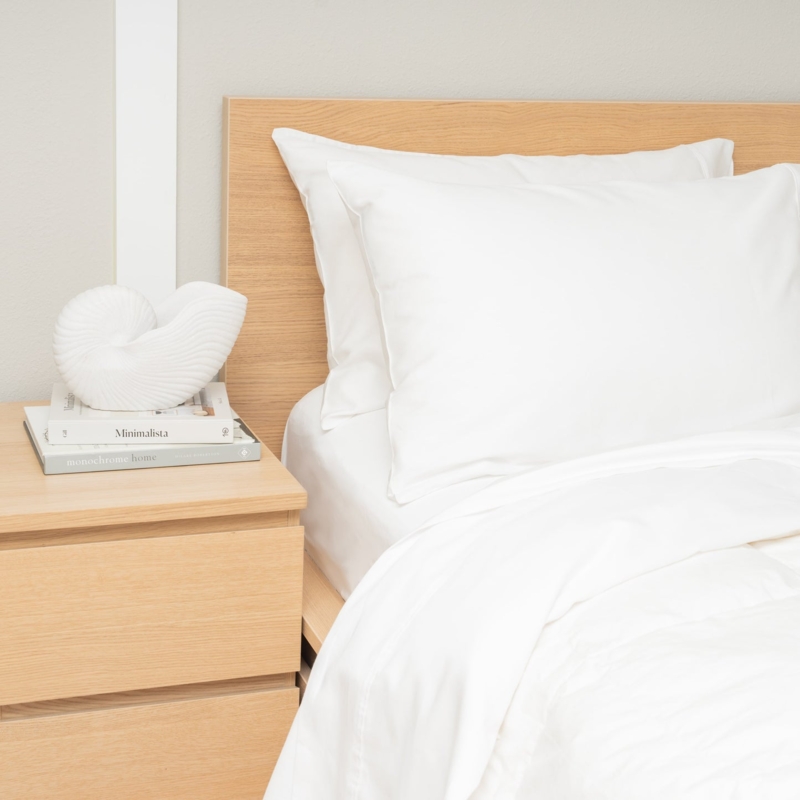 Deep Navy Blue Sateen Sheet Set with Lustrous Finish and White Pillows