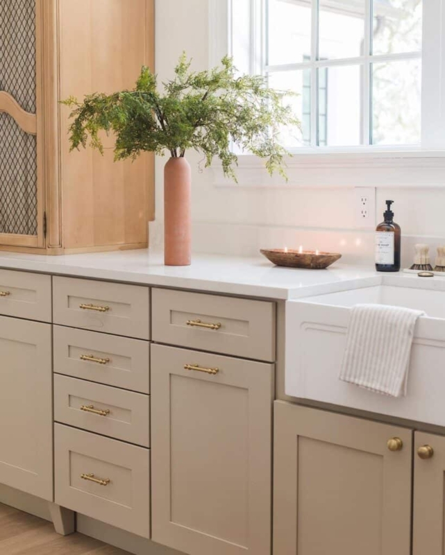 Drawer Pull: Antique Brass Cup Pulls on Beige Shaker Cabinetry