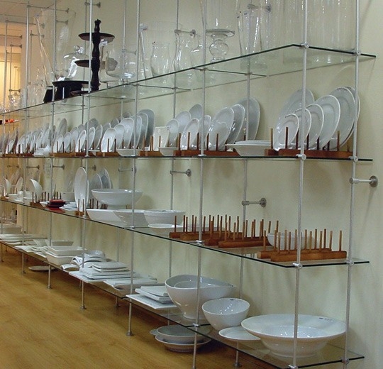 Industrial Wall Shelving: Black Tube Frame with Three Glass Tiers