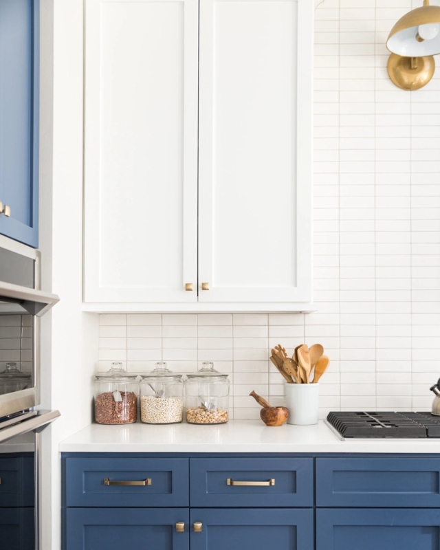 Knurled Bar Pulls: Brushed Brass on Two-Tone Navy and White Cabinets.