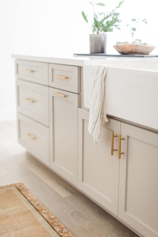 Modern Farmhouse Greige Cabinets with Gold T-Bar Pulls (65 characters)