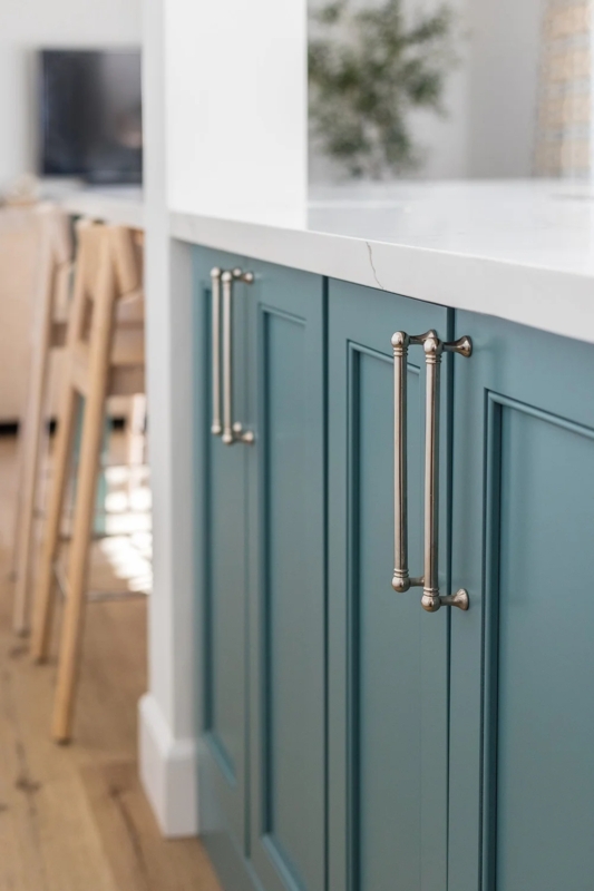 Navy Blue Shaker Cabinets featuring Mixed Gold Pulls and Knobs Hardware.
