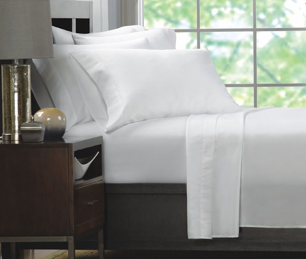 Neatly Stacked White Pillowcases for Minimalist Bedding