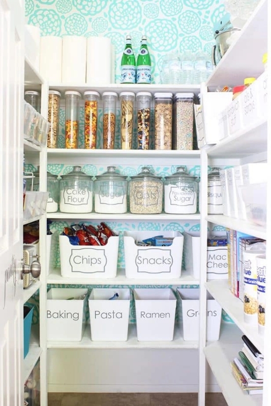 Pantry Organization Ideas with Teal Floral Wallpaper and Labeled Bins.