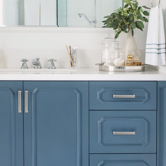 Slender Bar Cabinet Pulls: Brushed Silver on Modern Navy Blue Cabinetry.