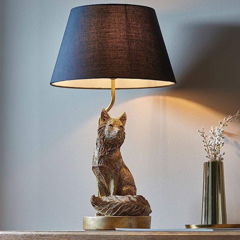 Table Lamp: Antique Gold Fox Shaped Base with Black Drum Shade Contrast.