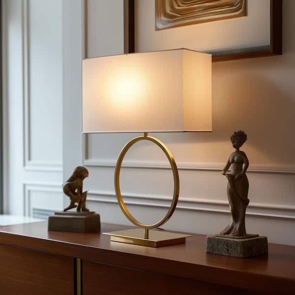 Table Lamp with Gold Circular Ring Base and Geometric Silhouette.